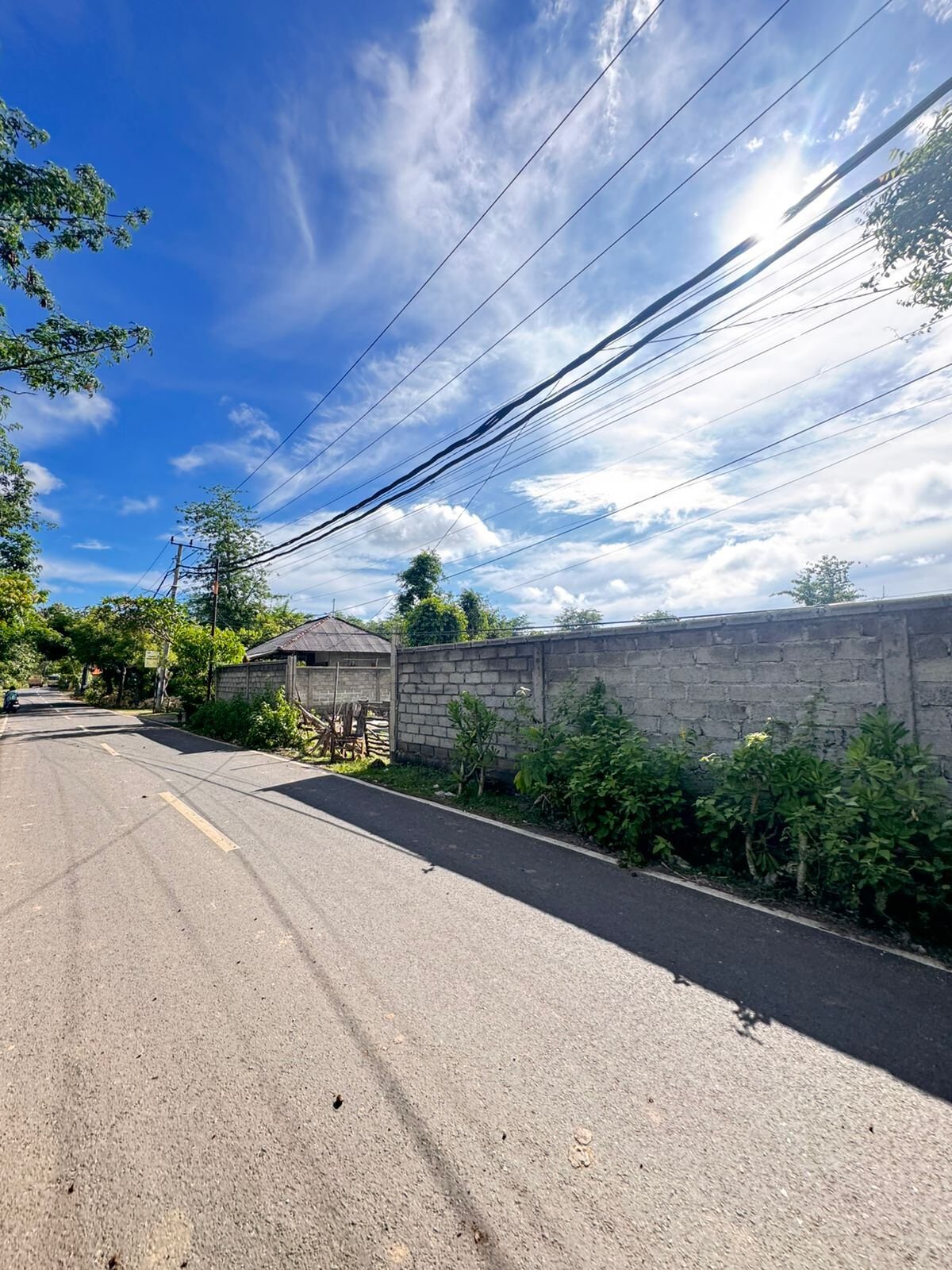 15 are plot of land, Balangan, the plot behind its wall, from the road